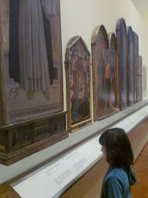 Mentre osservo 'San Vincenzo Ferrer e scene della sua vita' di Giovanni Francesco da Rimini (tempera su tavola)